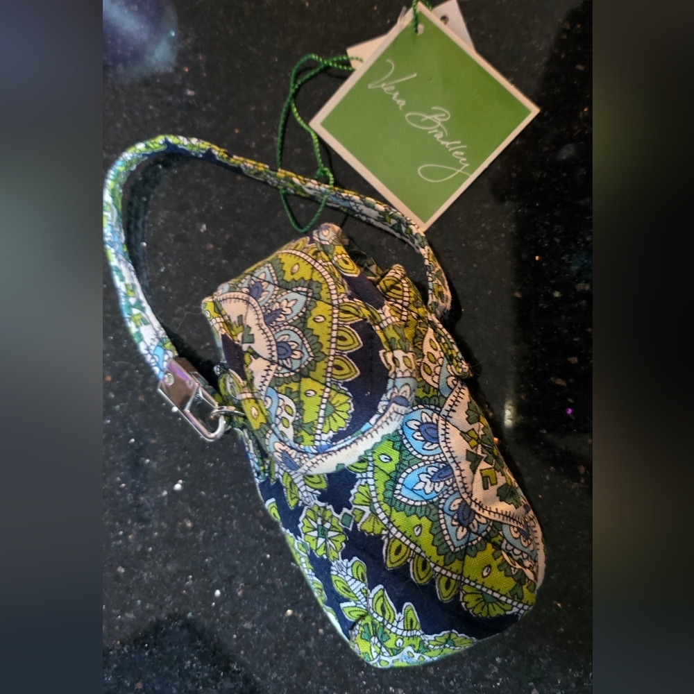 The NWT Vera Bradley Peacock Vintage Phone Wristlet Bag Holder Case is a stylish